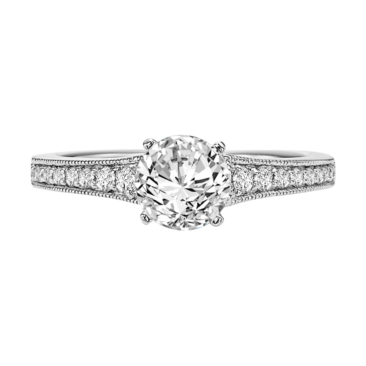 This engagement ring features a round center stone and graduating prong set diamond band with milgrain for alluring heirloom style