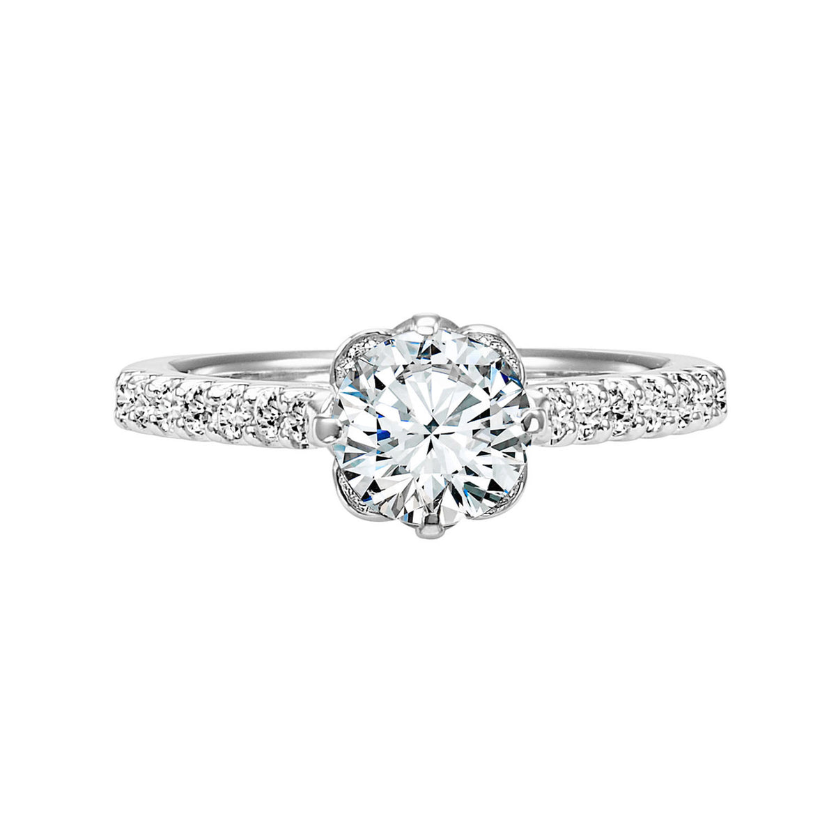 Romantic and enchanting, this engagement ring features a beautiful petite diamond crown accentuating thr center stone and diamond shared prong band