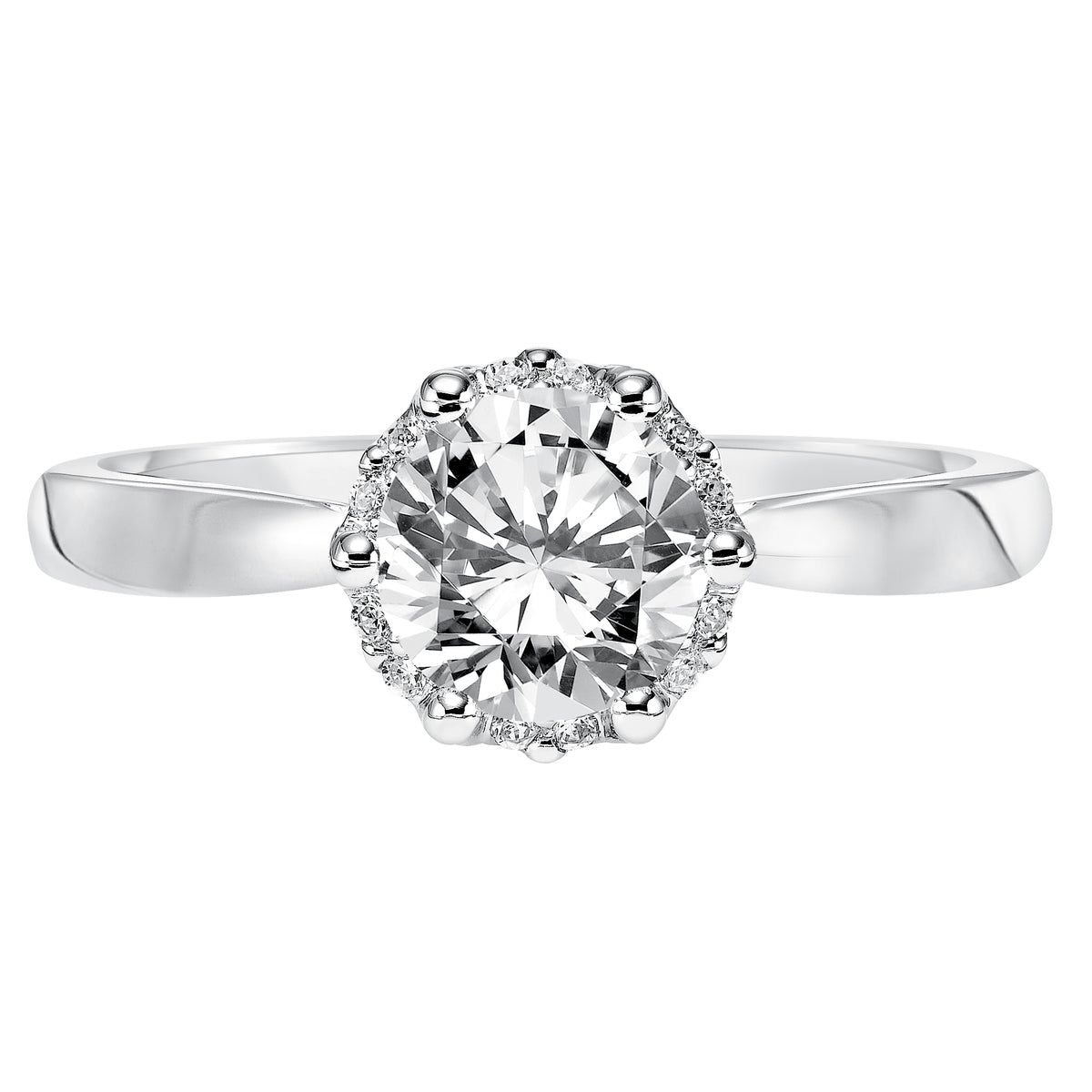Classic glamour inspired the design of this engagement ring featuring a round diamond brilliantly accentuated by a prong set diamond halo and high polished band
