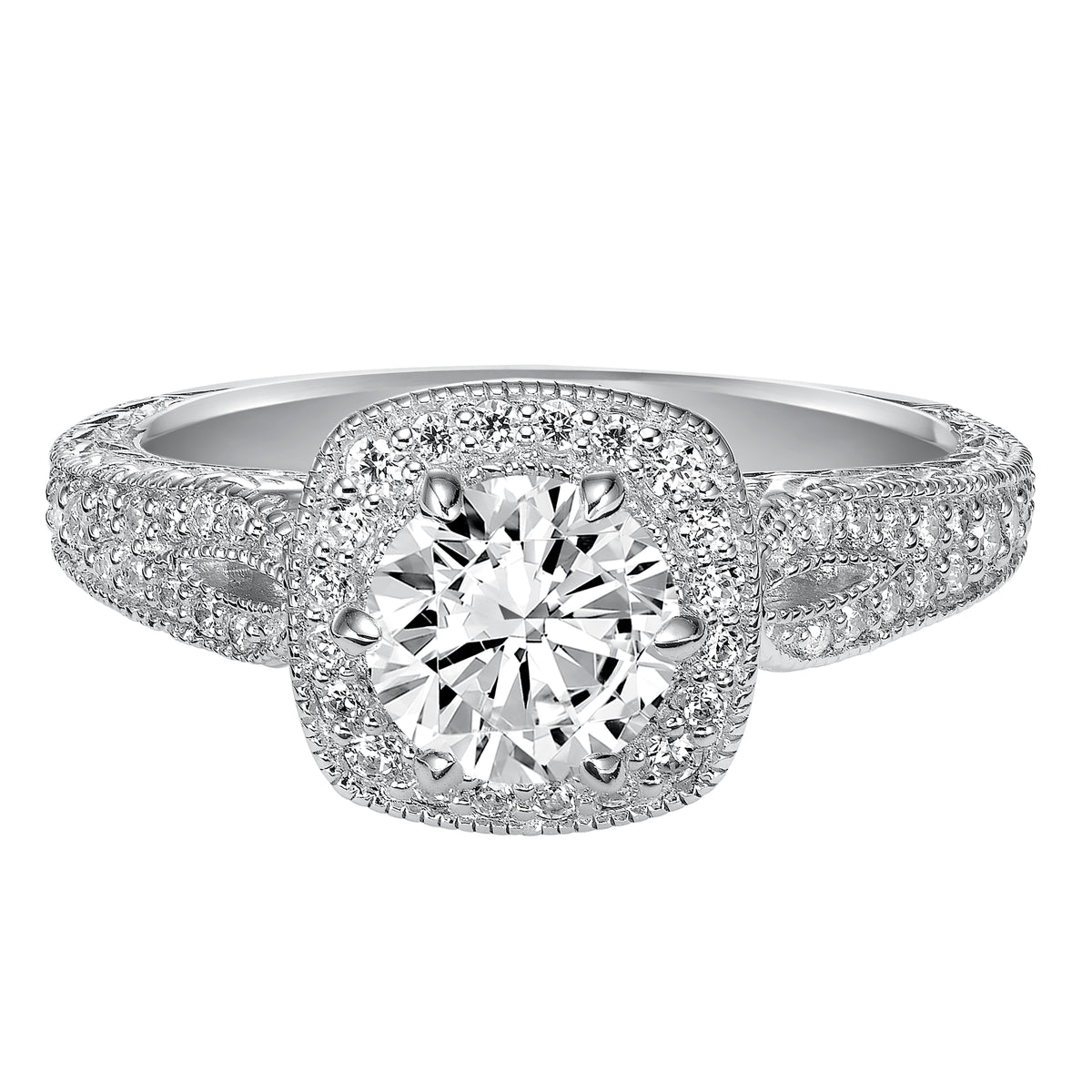 Modern meets vintage with this beloved engagement ring featuring a stunning prong set diamond halo and band with milgrain details and an engraved design