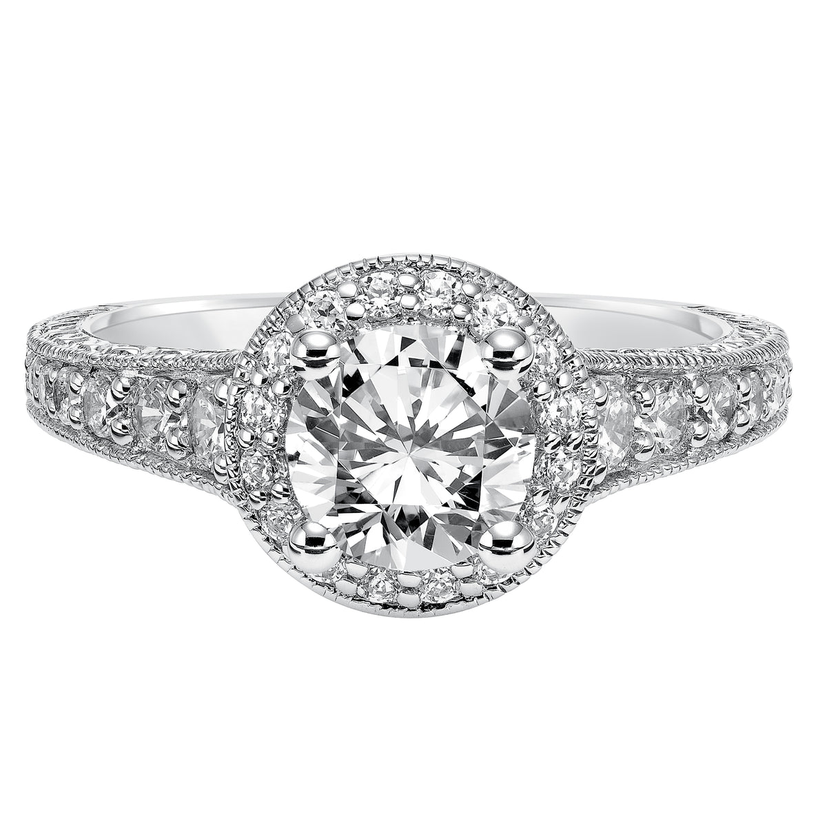 This show-stopping engagement ring is sure to impress with its diamond prong set halo and band with milgrain and engraving
