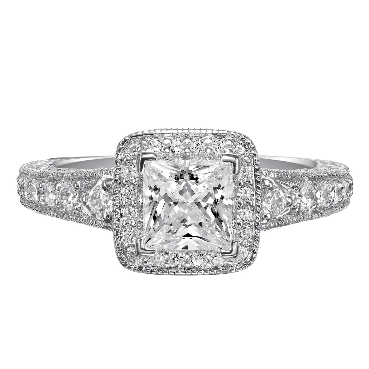 This princess cut diamond engagement ring is awe-inspiring with an impressive diamond prong set band with a intricate engraved design and milgrain detailing
