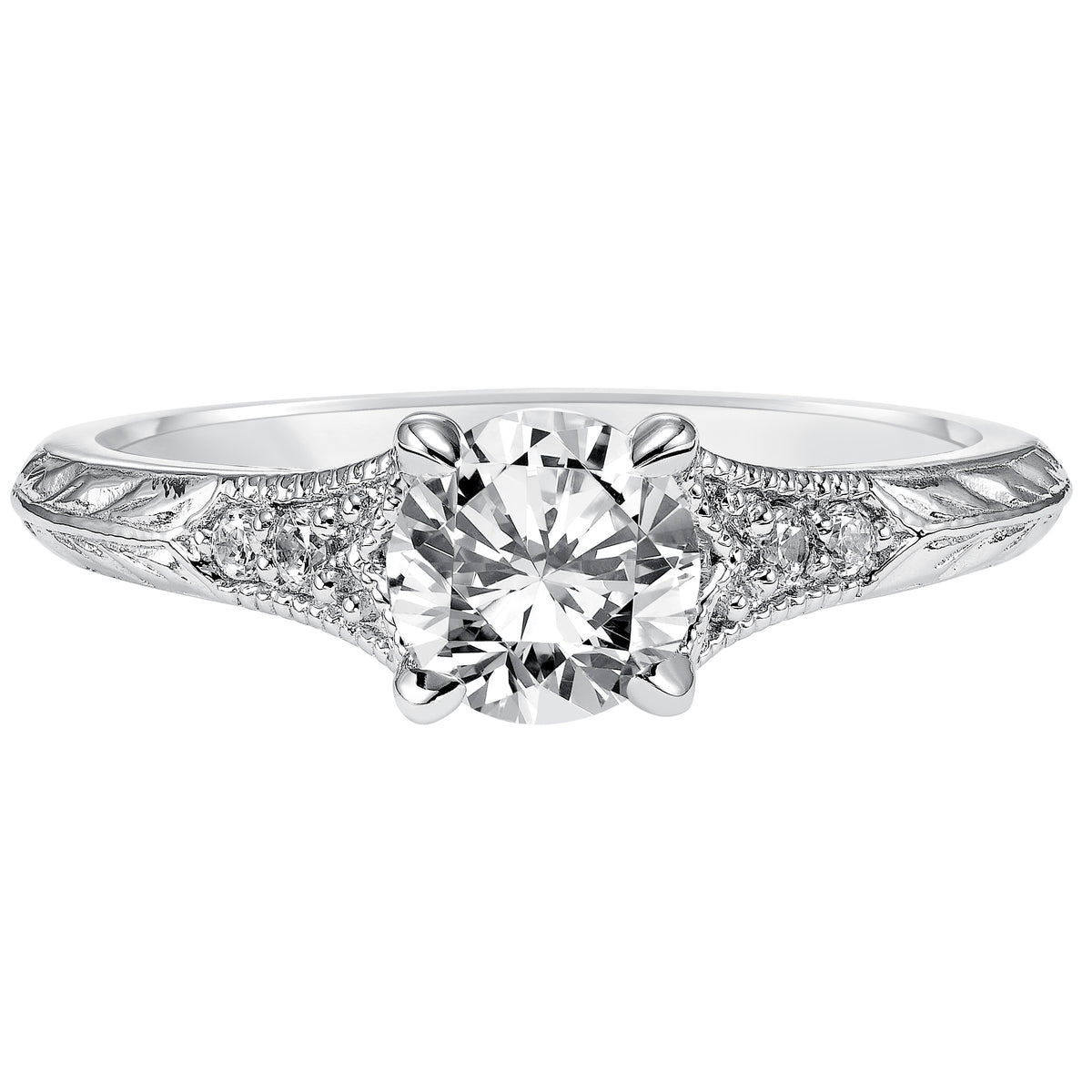 Modern heirloom style inspired the design of this engagement ring featuring a tapered diamond prong set band with milgrain and an engraved design