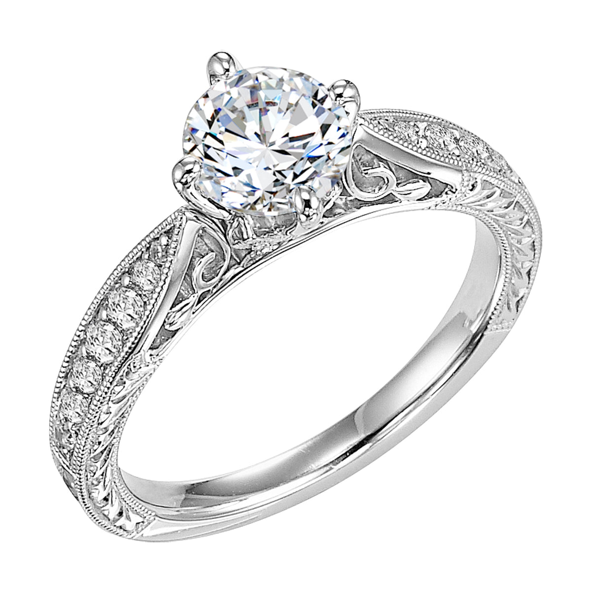 Masterfully crafted, this engagement ring dazzles with its round center stone and prong set diamond band with delicate milgrain and beautiful engraving