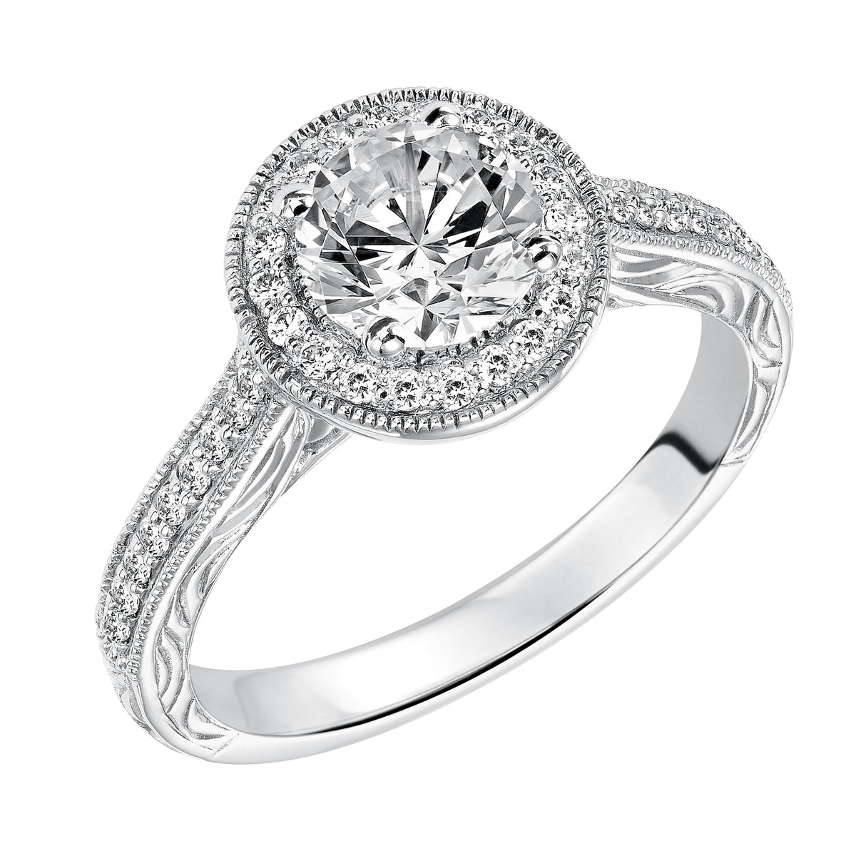 This captivating vintage inspired diamond halo engagement ring features a diamond and milgrain band with a delicate engraved design to complete to the look