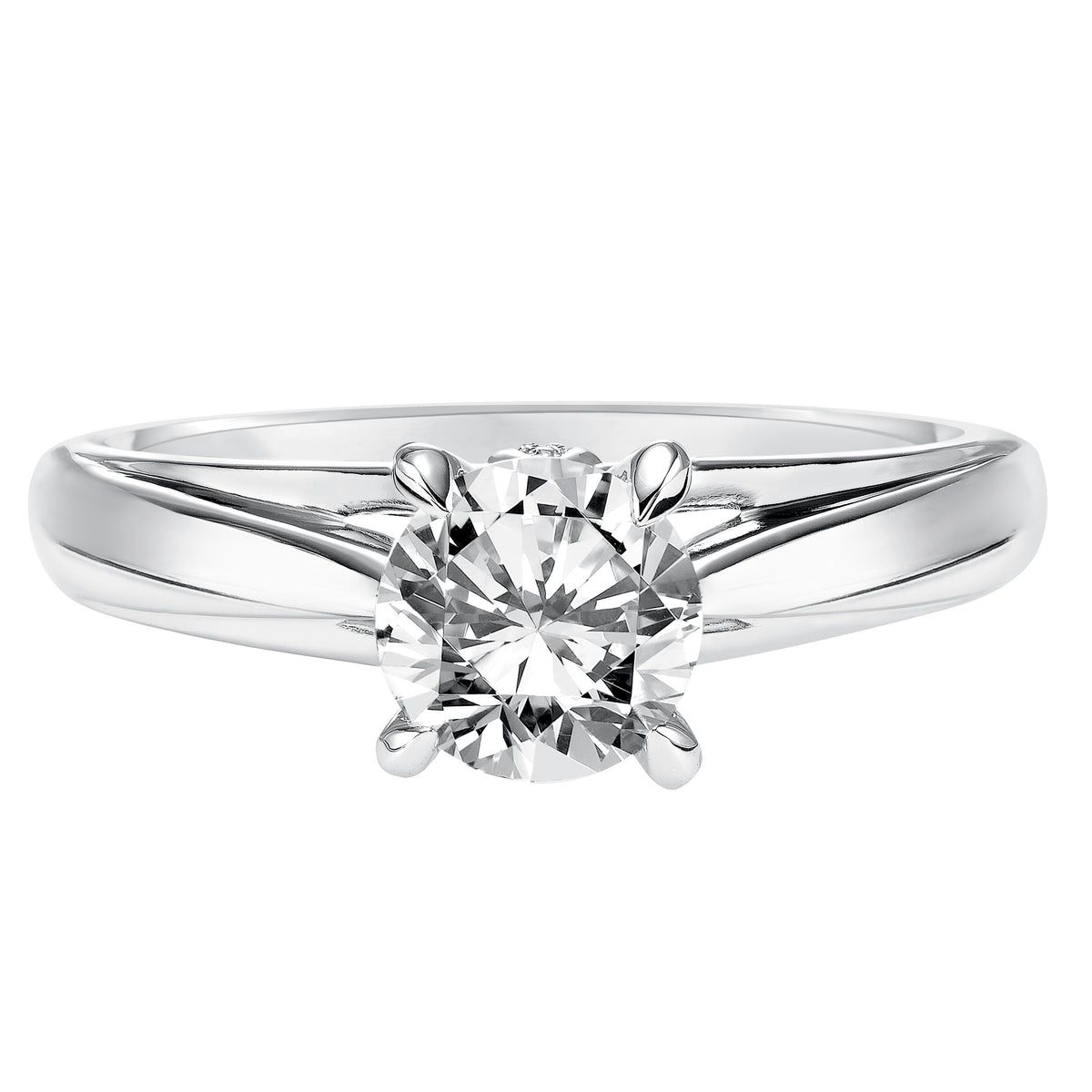 Classic with a twist for a timeless yet unique look This solitaire engagement ring features a four prong setting and high polished band with a surprise diamond accent