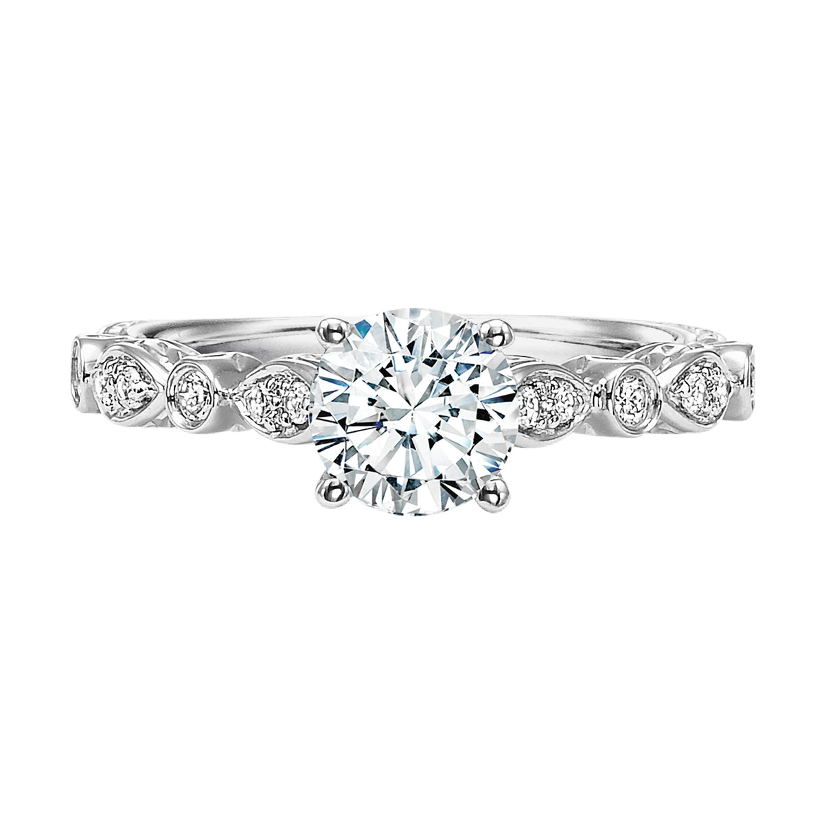 This prong set diamond and engraved band dazzles with distinct yet delicate styling
