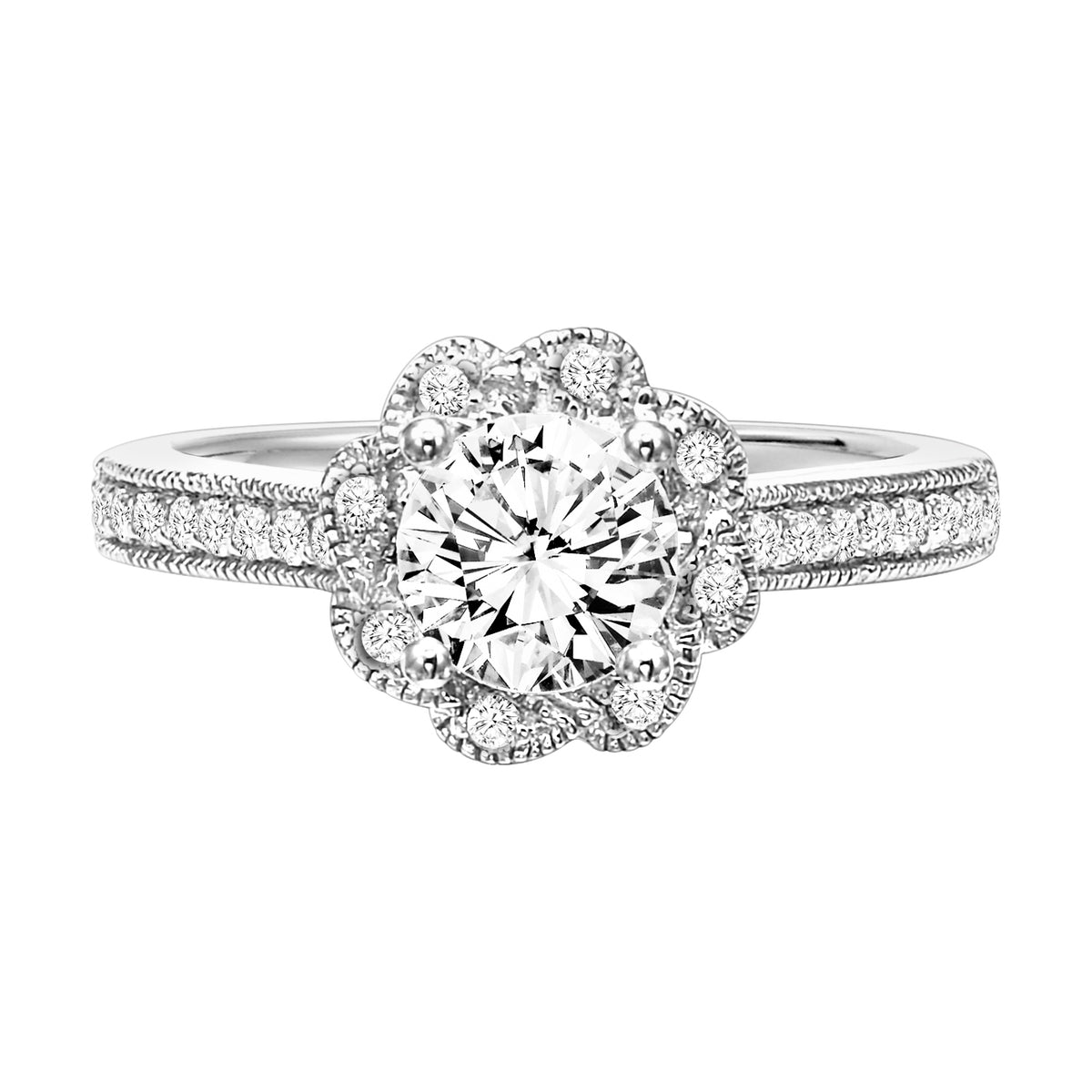 Charming and beautiful, this diamond prong set engagement ring features a gorgeous petal inspired halo with milgrain accentuating the round center diamond