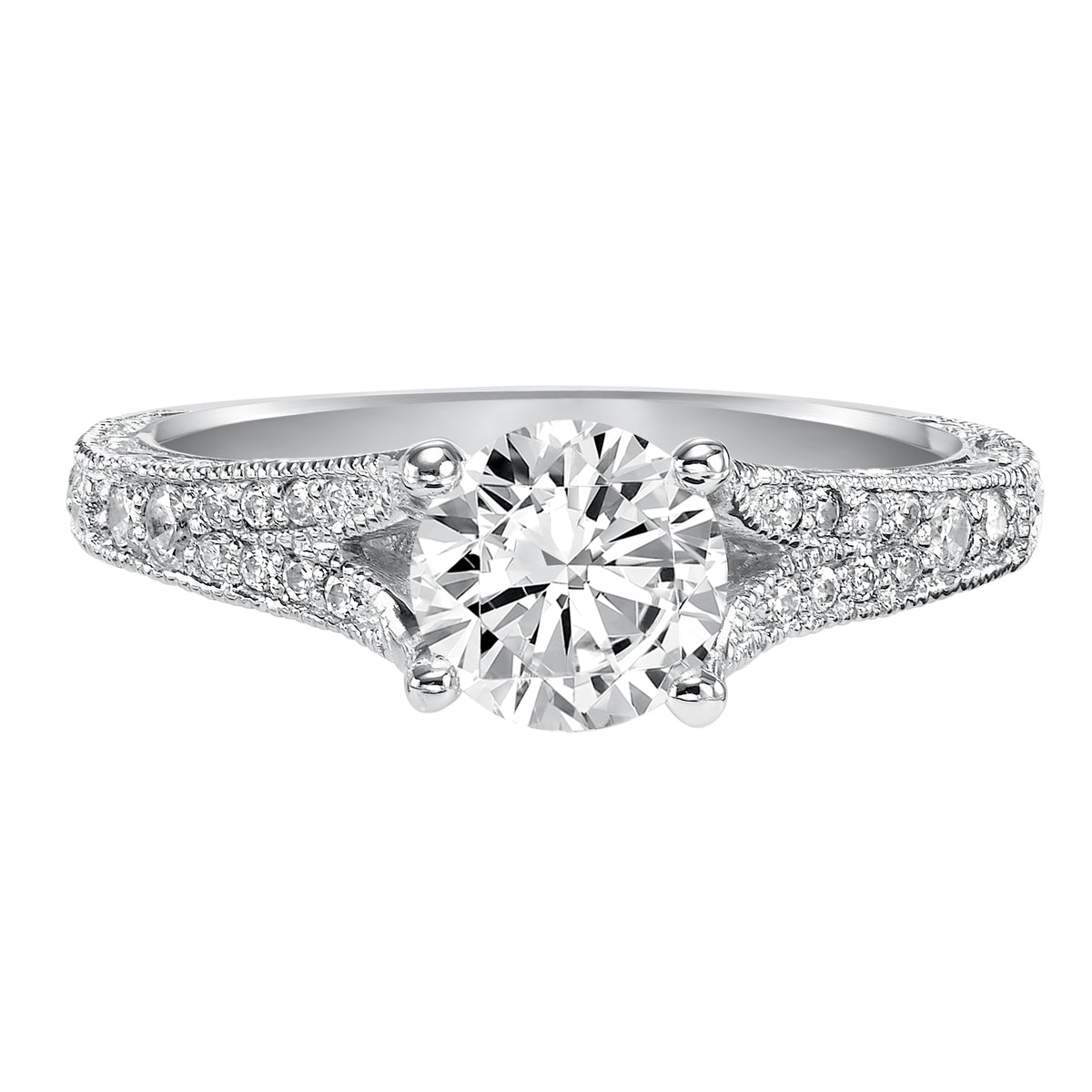 This vintage chic inspired design features a diamond prong set split band with delicate engraving and milgrain accents