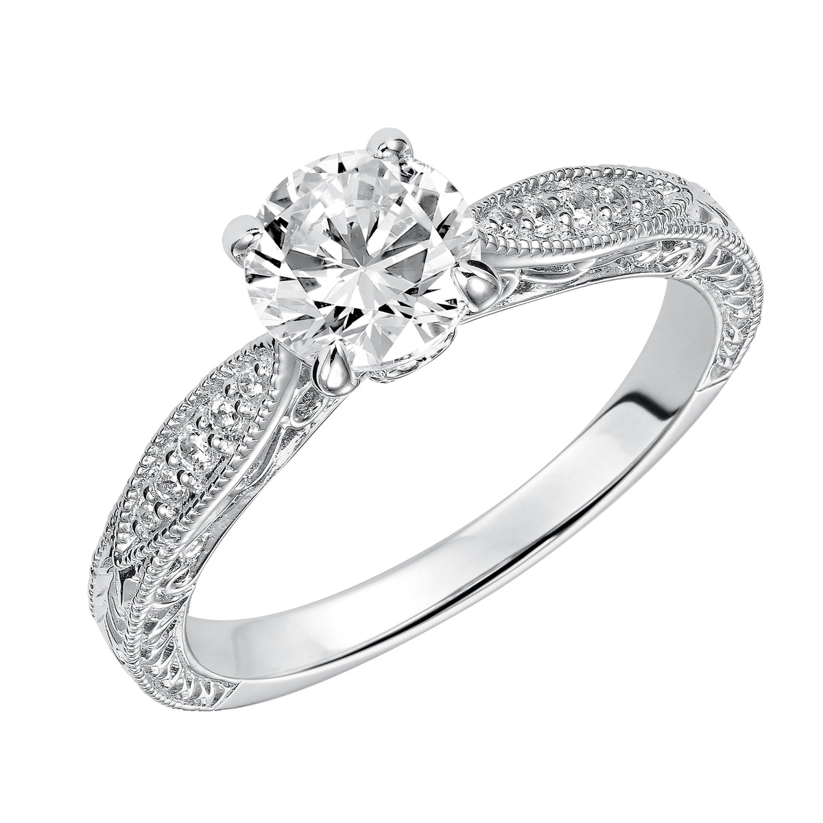 Absolutely exquisite with its intricate design, this round diamond engagement ring features a diamond prong set band with a gorgeous engraved design with milgrain details