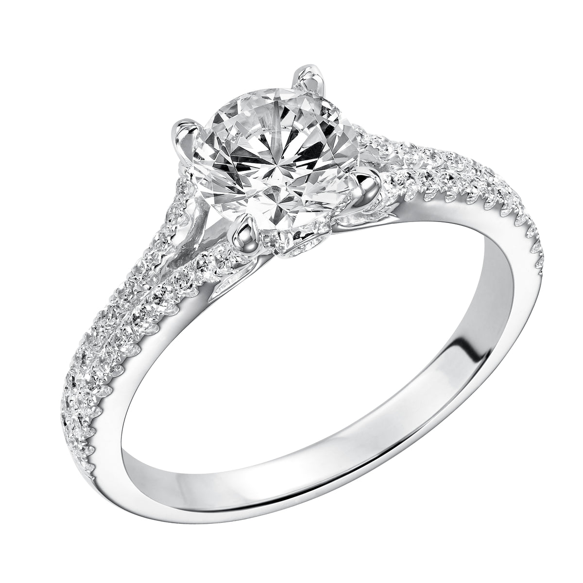 This distinguished prong set engagement ring features a round diamond center stone accentuated by a delicate, diamond prong set split band