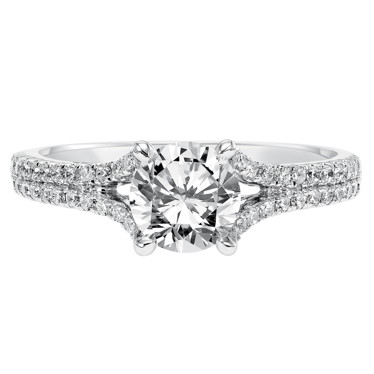 This distinguished prong set engagement ring features a round diamond center stone accentuated by a delicate, diamond prong set split band