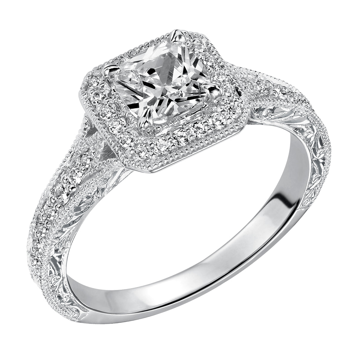 This cushion cut diamond engagement ring dazzles with its stunning prong set diamond halo and band enhanced with milgrain and an engraved design