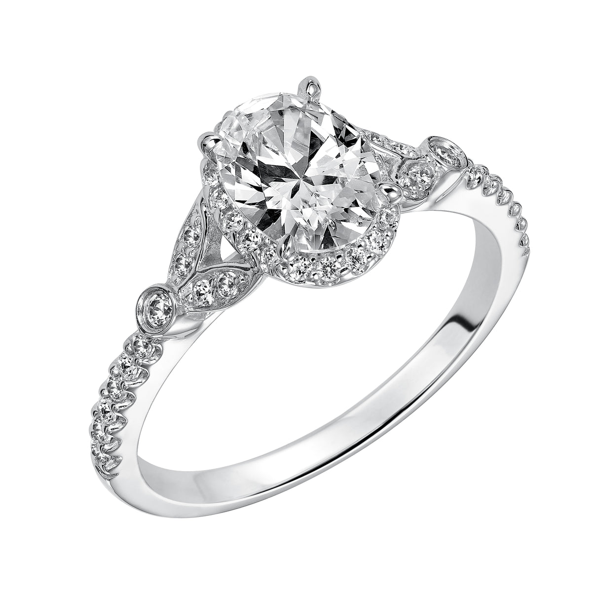 This romantic and beautiful engagement ring features an oval cut diamond accentuated by a prong set diamond halo and petal-inspired band design