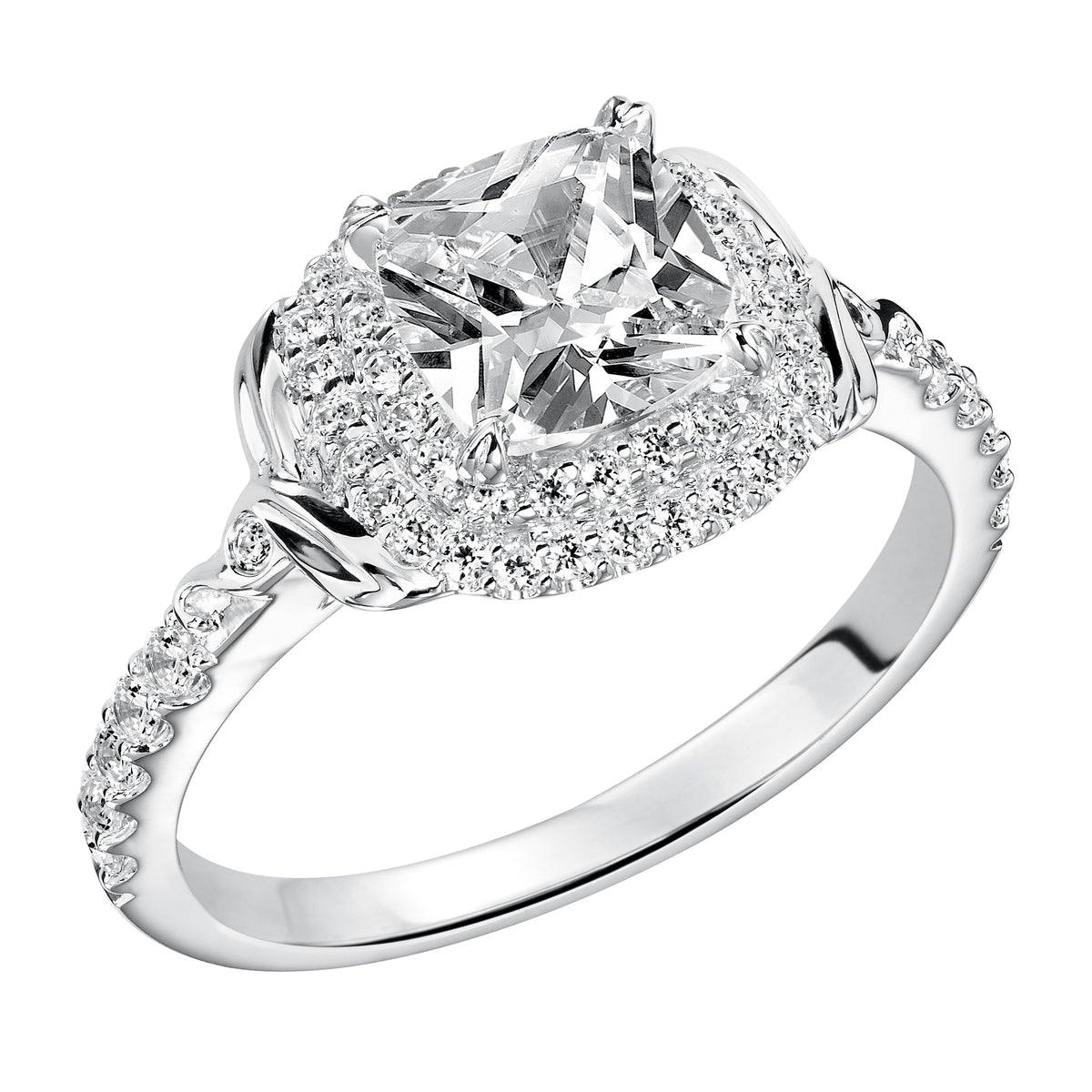 This cushion cut engagement ring is a show-stopper with its two-row diamond prong set halo, high polished accents and delicate prong set diamond band