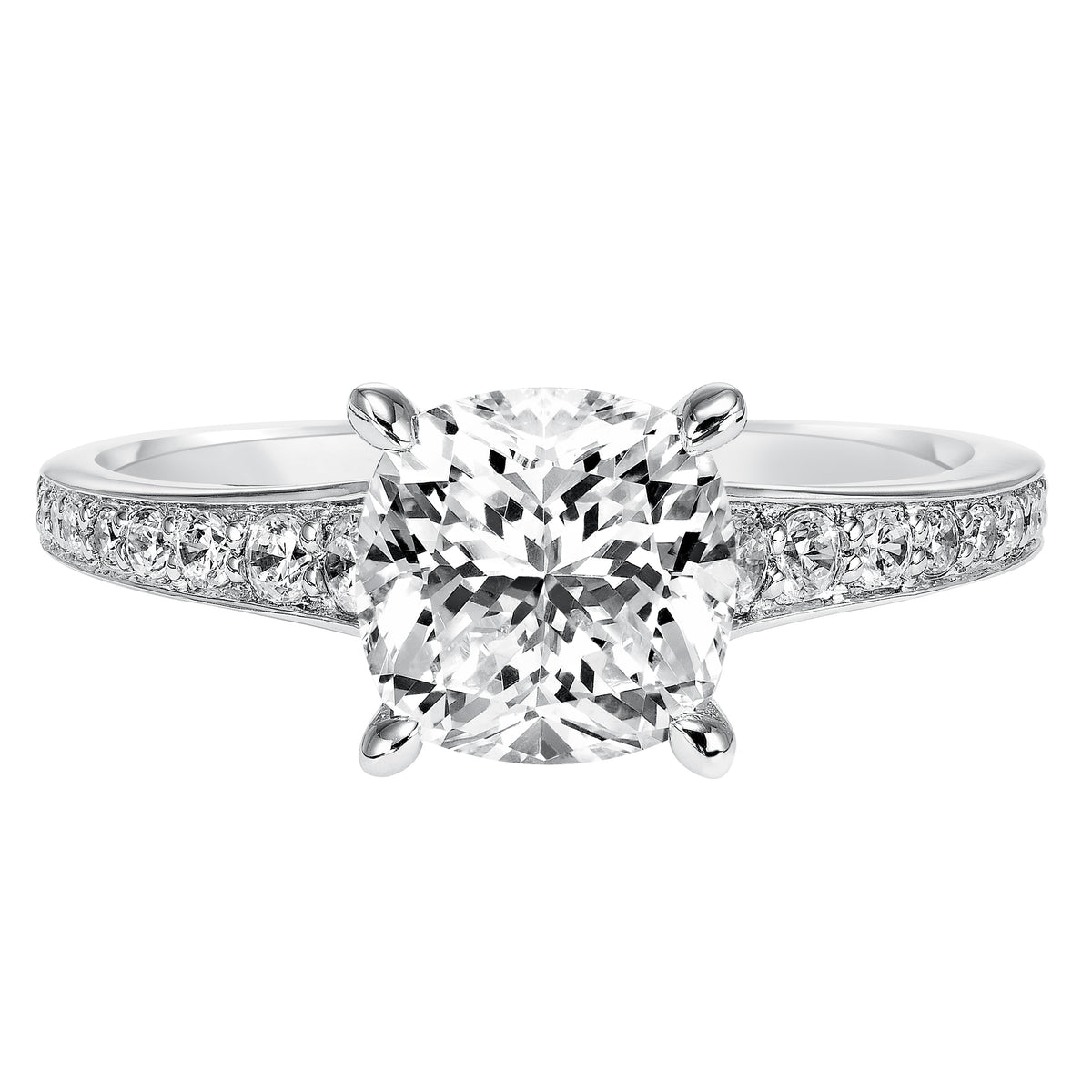 This cushion cut engagement ring is gracefully accentuated by a classic diamond prong set band