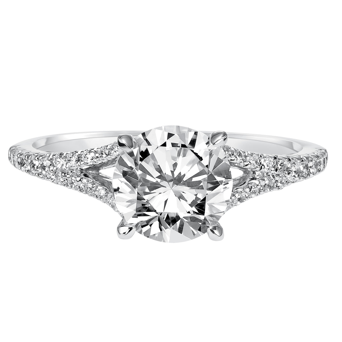 Striking yet elegant, this round diamond engagement ring features a delicate prong set diamond split band