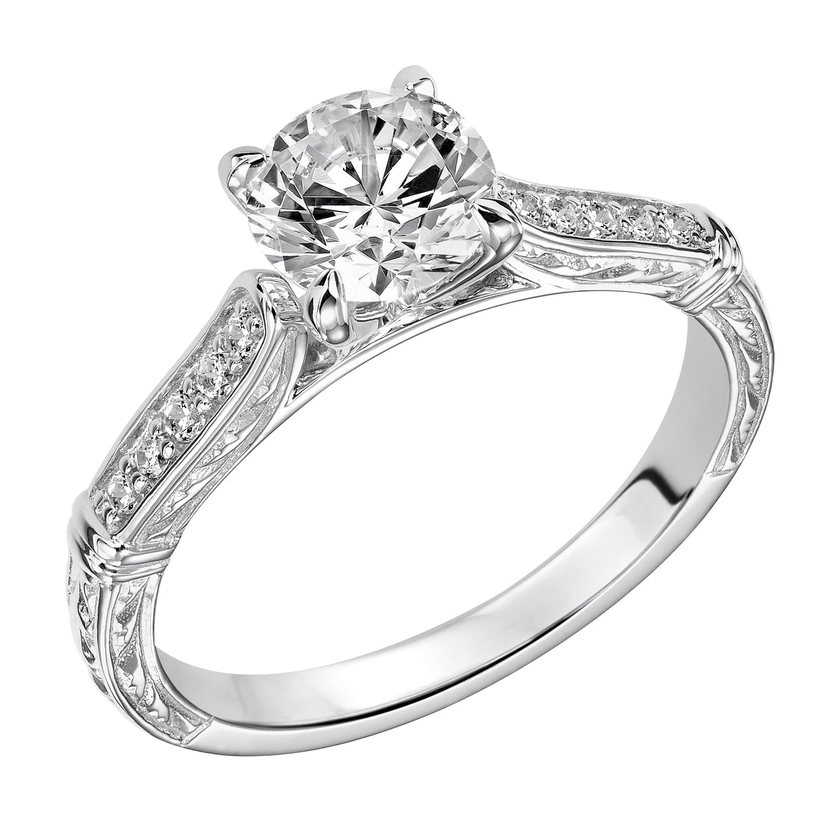 This brilliant round diamond is beautifully paired with this prong set diamond band enhanced with engraving
