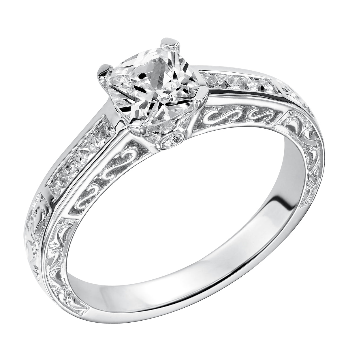 This gorgeous cushion cut diamond is accentuated by a sophisticated channel set diamond band, with delicate filigree and engraving