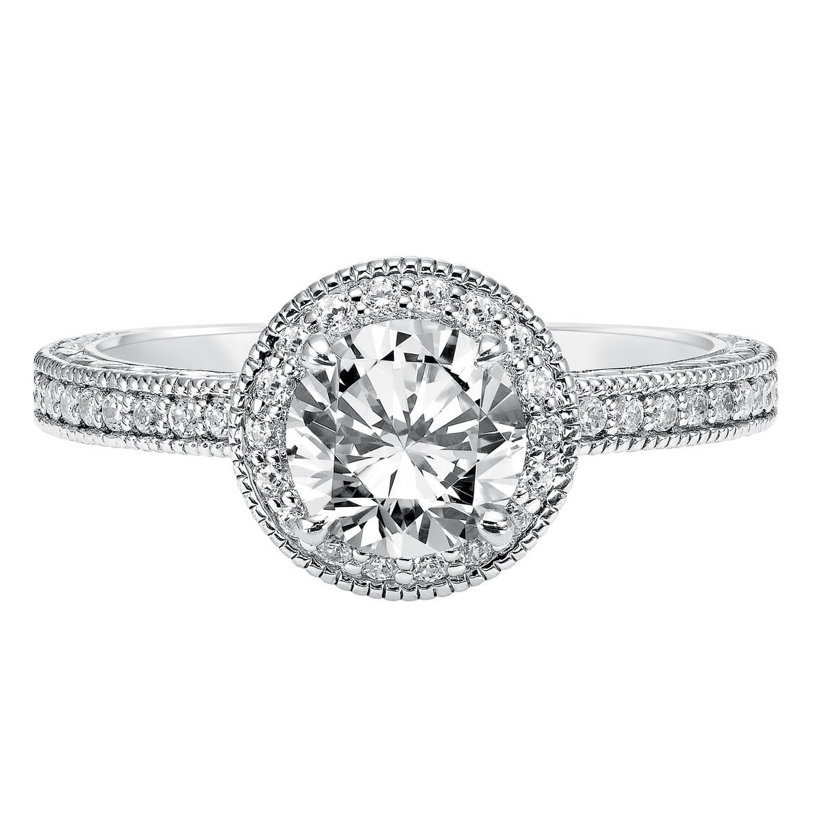 Exquisite details grace the design of this engagement ring featuring a dazzling diamond halo, delicate engraving and milgrain accents