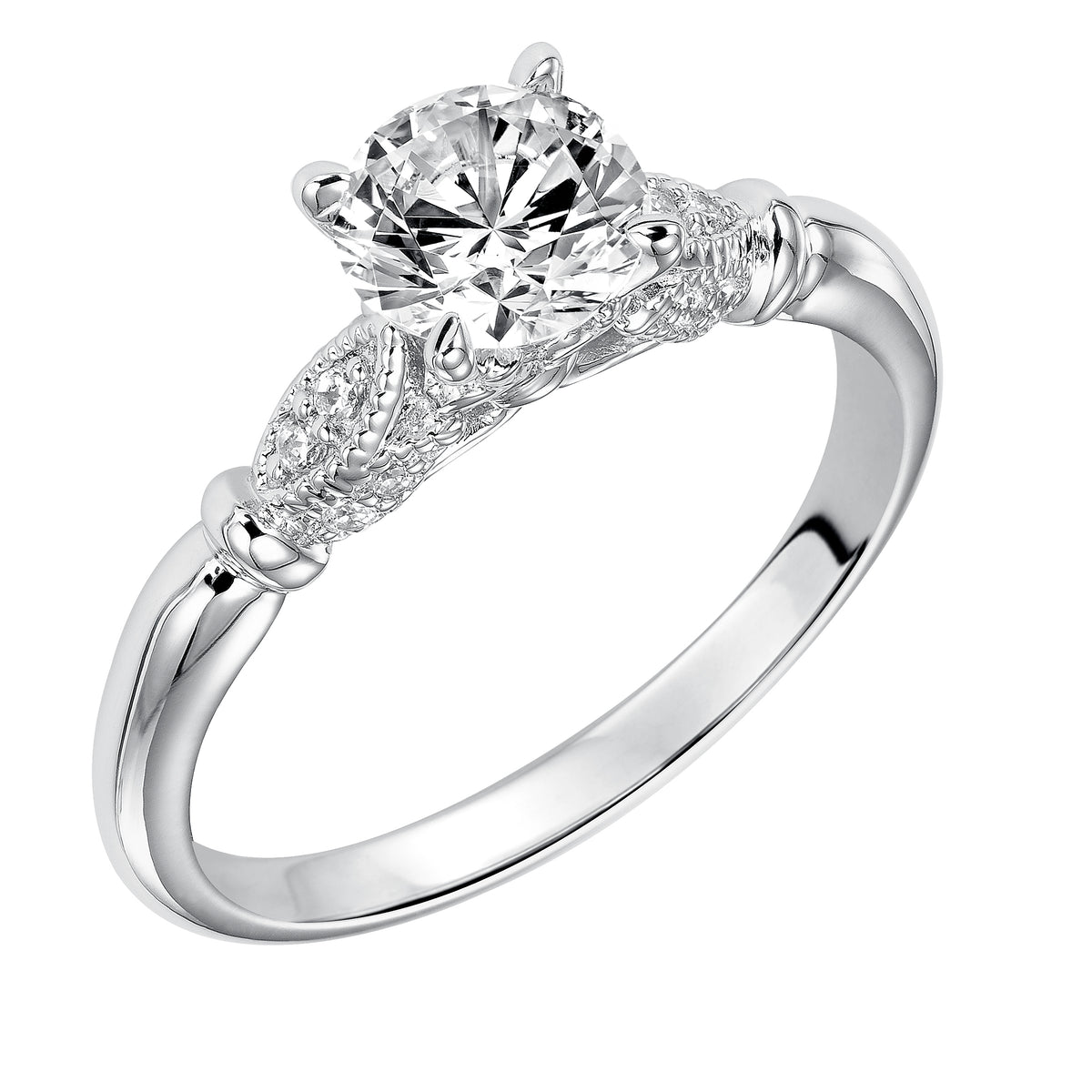 This round diamond engagement ring is simple yet elegant featuring a delicate diamond prong set petal design with milgrain accentuating the center stone on each side