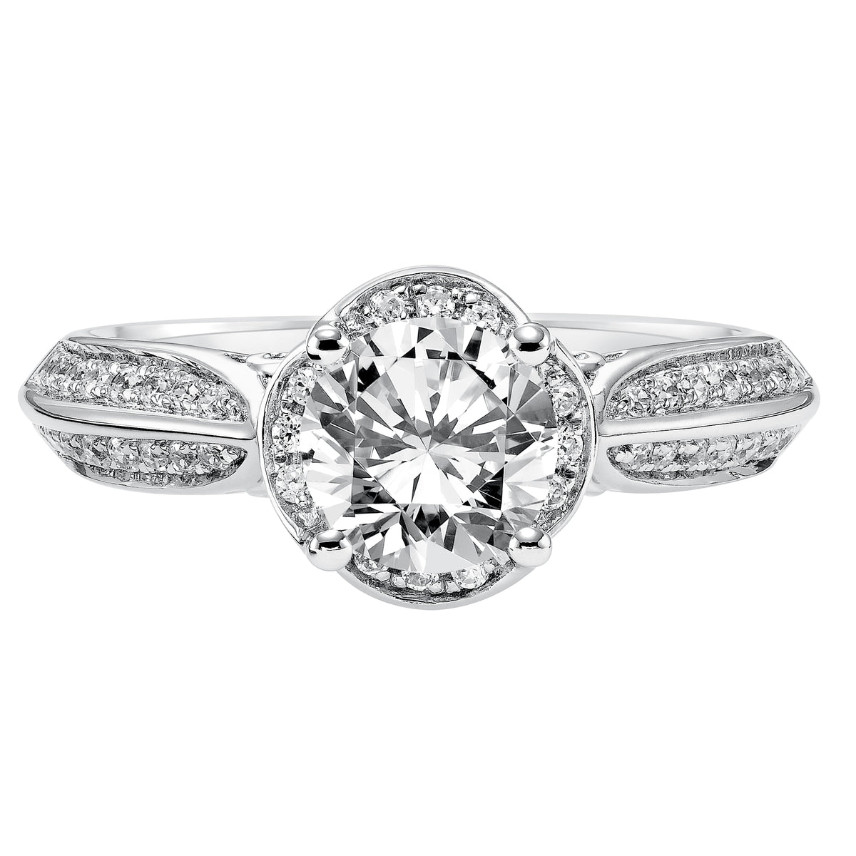 Alluring and romantic, this diamond engagement ring is lovely with its prong set diamond and filigree design details