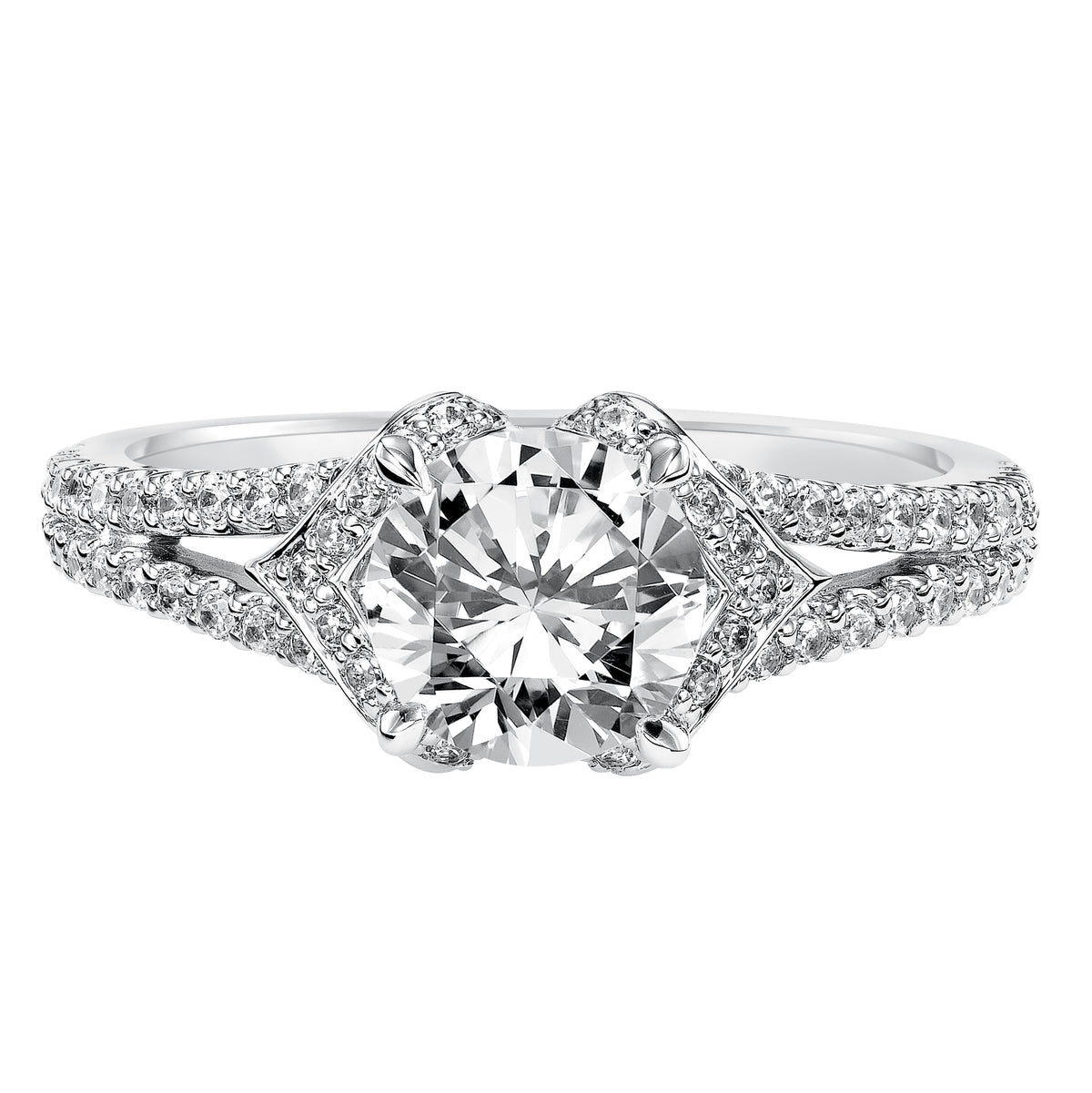 Featuring a delicate diamond prong set split band and unique tiara like setting crowning the center diamond, this engagement ring is truly eye-catching