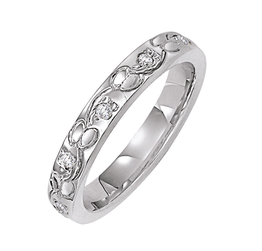 Wedding band with engraved design and diamond accents.