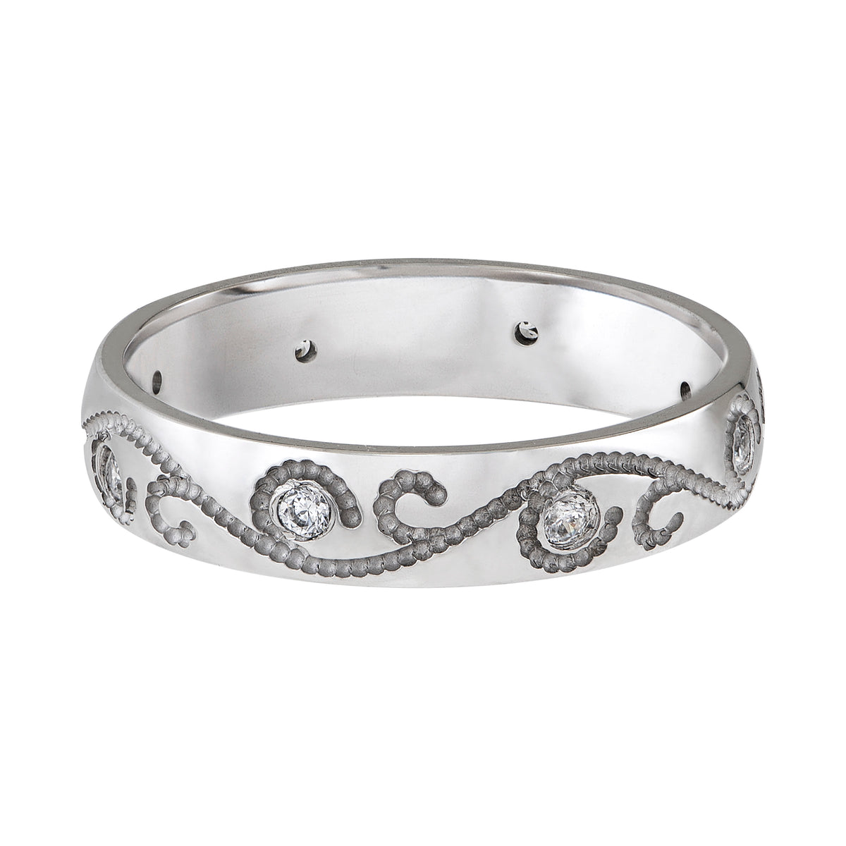 Wedding band with engraved design and diamond accents.