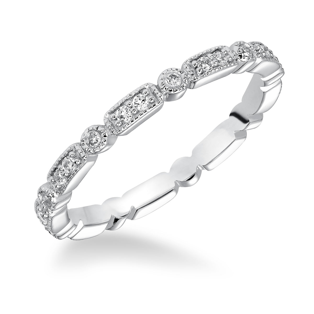 Wedding band featuring a geometric-inspired design with round diamonds and milgrain.